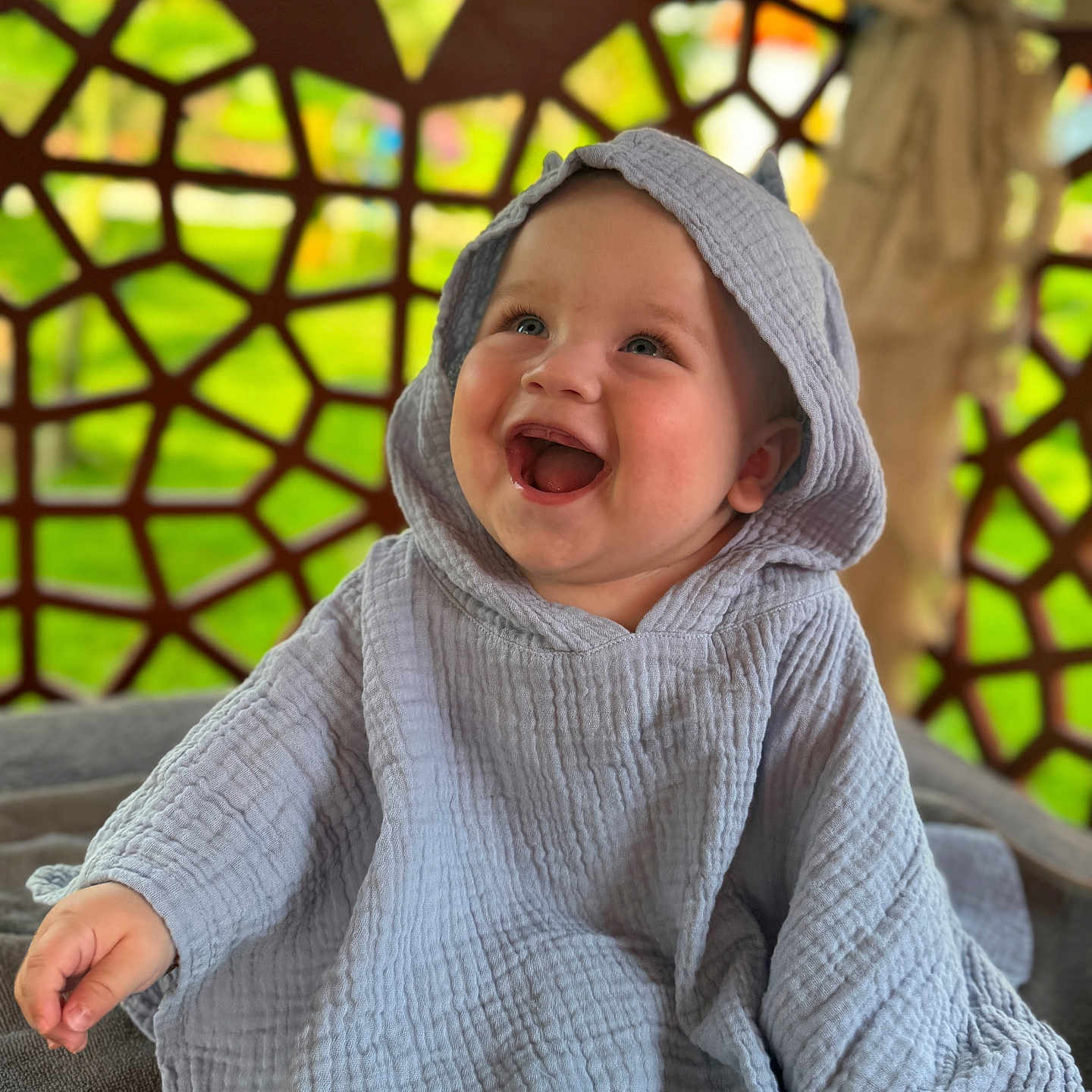 Patric Matei is registered to the contest to win money with this photo: baby, background_pattern, child, colorful, cozy, cute, expression, face, happy, hooded_blanket, indoor, infant, joyful, playful, portrait, sitting, smiling, soft_light, textured_clothing, young