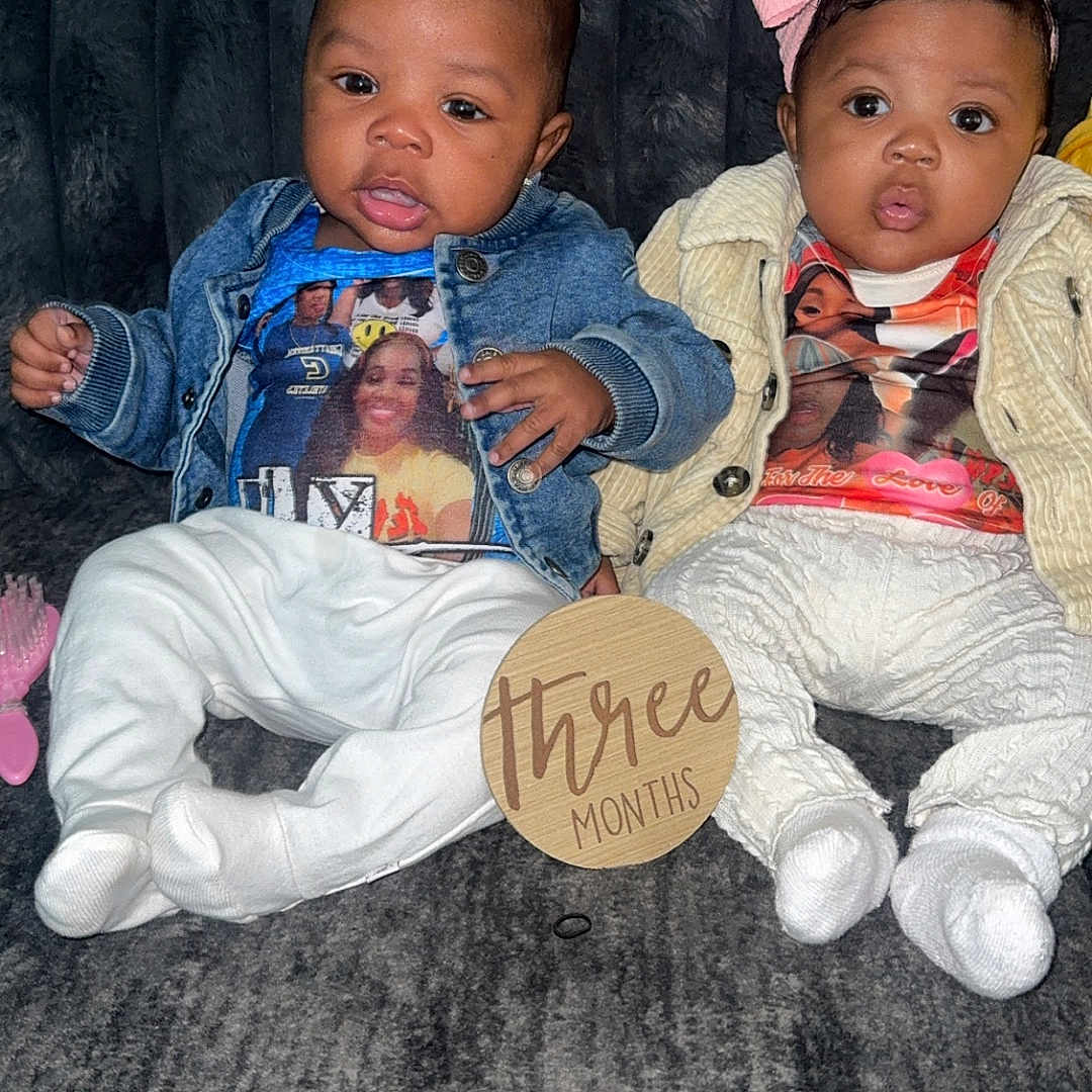 Rexon And Riyae is registered to the contest to win money with this photo: adult, baby, clothing, coat, couch, face, female, furniture, hat, head, jacket, jeans, male, man, pants, person, photography, portrait, sitting, woman