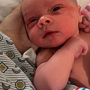 Elliot joined the competition — help win amazing prizes! newborn, baby, infant, close_up, hand, blanket, skin, face, eyes, arm, person, bed, rest, sleepy, soft_lighting, newborn_clothing, comfort, caring, family, child