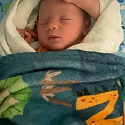 Nolan joined the competition — help win amazing prizes! baby, bed, bedroom, blanket, face, food, fruit, furniture, head, homedecor, indoors, newborn, pear, person, photography, plant, portrait, produce, quilt, sleeping