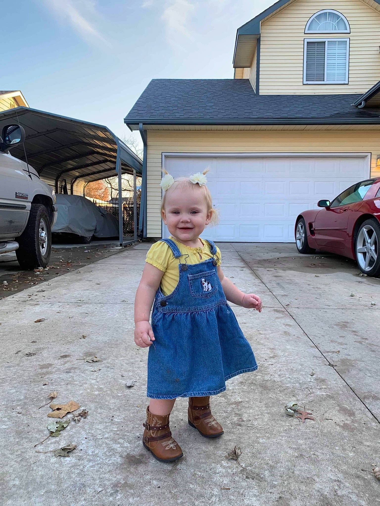 Rylynn is registered to the contest to win money with this photo: asphalt, car, child, cloud, family_car, footwear, home, house, joy, luxury_vehicle, male, mountain, parking, people, person, sky, sports_sedan, summer, toddler, vacation