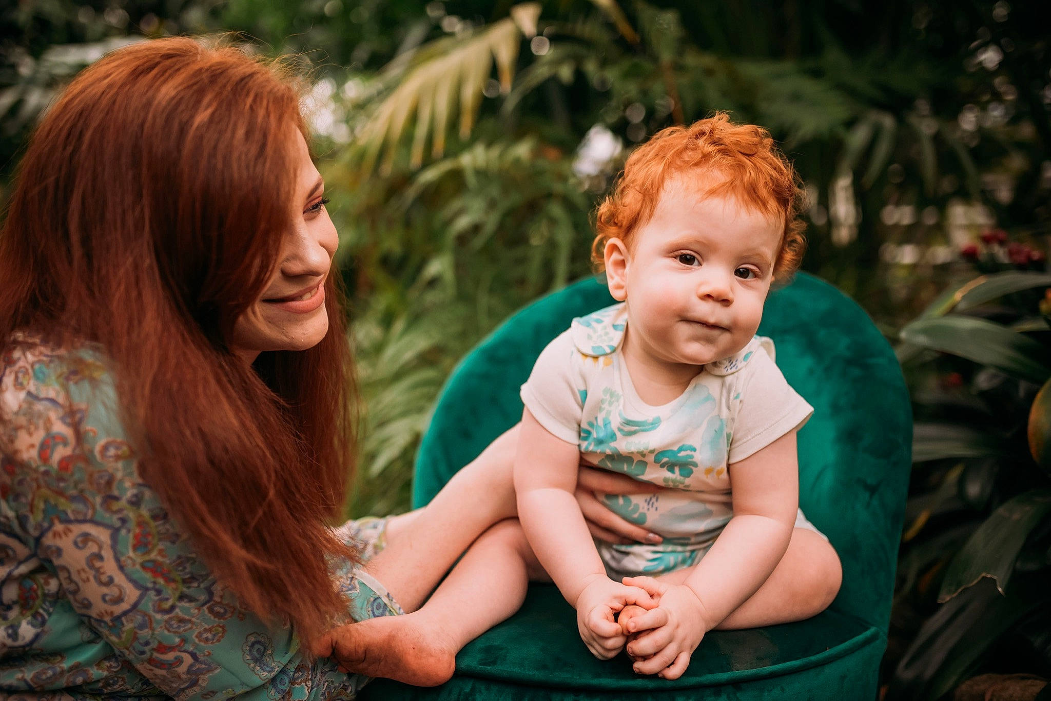 Andreas is registered to the contest to win money with this photo: adaptation, child, eye, face, family, fun, grass, green, leaf, people, people_in_nature, person, photograph, photography, plant, red_hair, sitting, smile, toddler, tree
