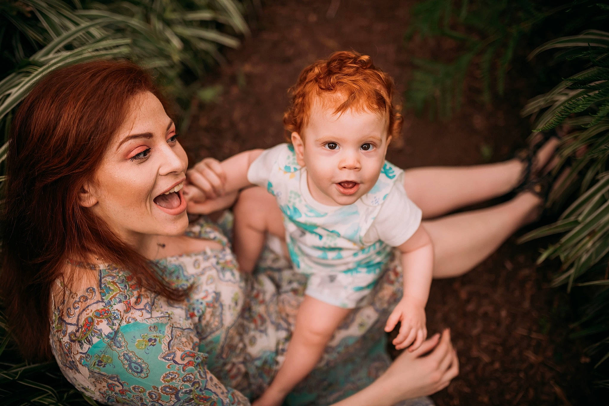 Andreas is registered to the contest to win money with this photo: baby, child, face, family, flash_photography, fun, grass, happy, people, people_in_nature, person, photograph, photography, portrait_photography, sitting, skin, smile, toddler, tree, vacation