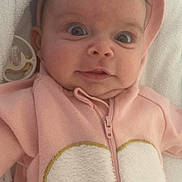 Andrea participe au concours pour gagner de l'argent avec cette photo : baby, infant, pink_hoodie, heart, pacifier, blanket, face, wide_eyes, cute, child, soft_texture, clothing, portrait, lying_down, young, adorable, baby_girl, expression, hood, zipped_jacket