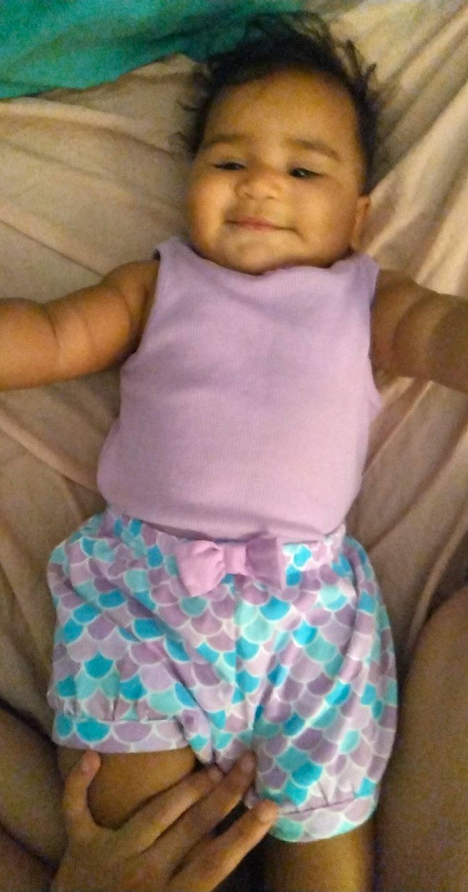 Hélena joined the competition — help win amazing prizes! abdomen, baby, baby_toddler_clothing, cheek, child, comfort, eye, gesture, green, happy, head, linens, pattern, person, pink, purple, skin, sleeve, smile, t_shirt