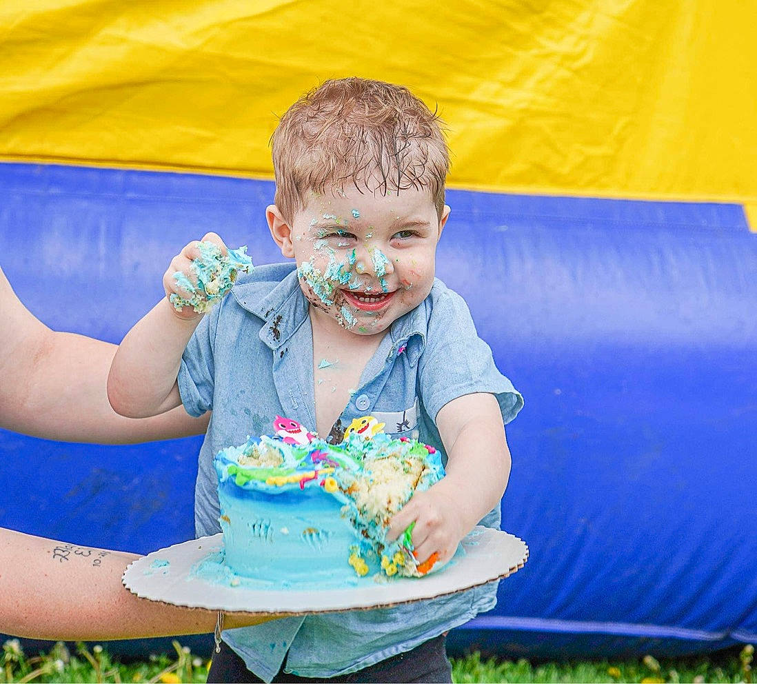 Clayton joined the competition — help win amazing prizes! baby_toddler_clothing, birthday, blue, cake_decorating, cake_decorating_supply, child, dessert, event, fun, grass, happy, inflatable, joy, leisure, people_in_nature, person, recreation, sitting, smile, sugar_cake
