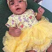 Janeishka joined the competition — help win amazing prizes! baby, infant, child, yellow_tutu, headband, cartoon_prints, smiling, curious, green_background, clothing, cute, indoors, baby_girl, toddler, sitting, soft_light, portrait, close_up, happy, playful
