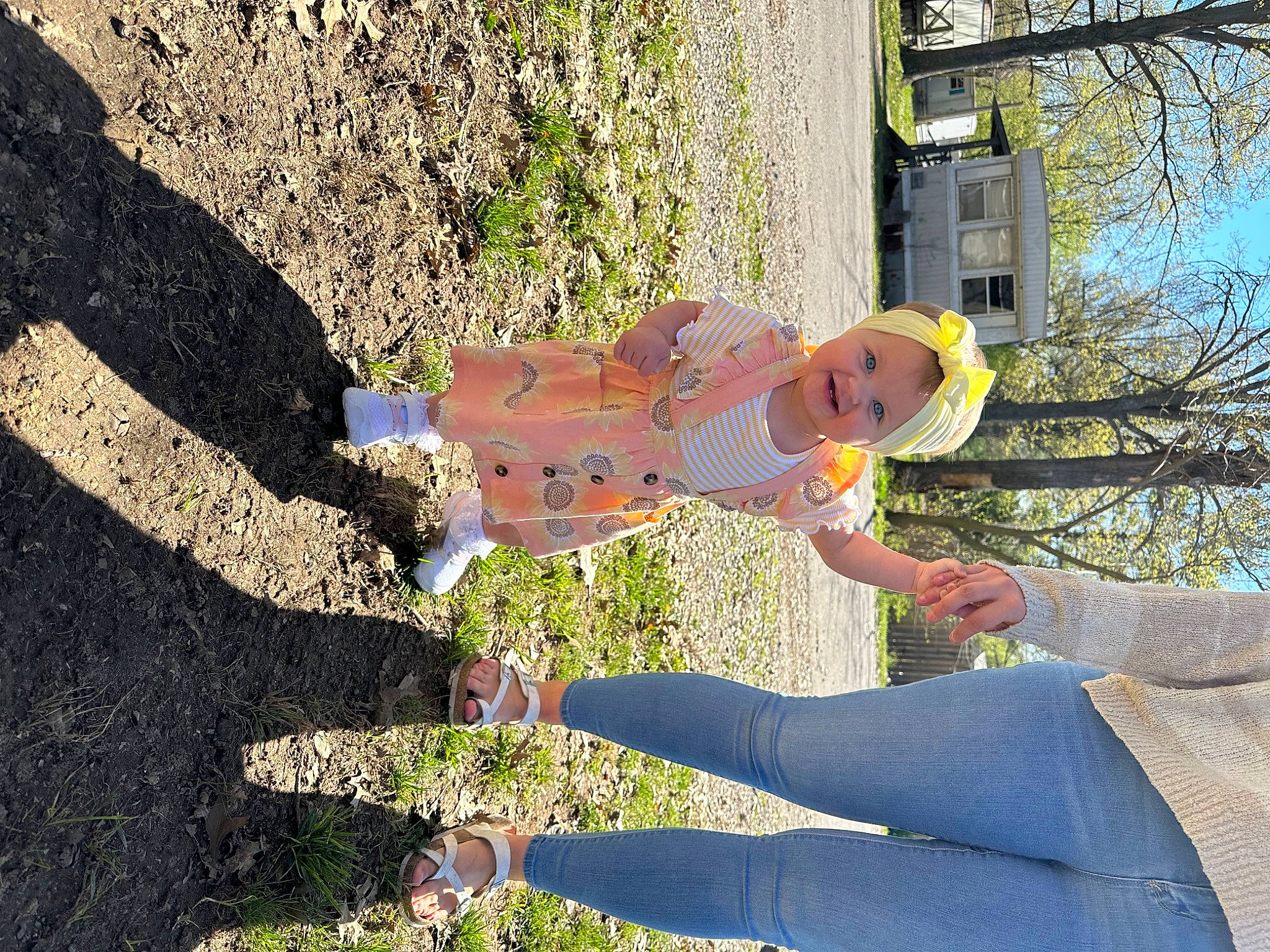 Paisley joined the competition — help win amazing prizes! baby, child, concrete, fun, gesture, grass, happy, hat, headwear, human_leg, leisure, people_in_nature, person, plant, play, recreation, shadow, sky, thigh, toddler