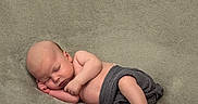 Noah joined the competition — help win amazing prizes! baby, sleeping, infant, blanket, soft_texture, cozy, peaceful, wrapped, newborn, skin, barefoot, resting, child, cute, portrait, lying_down, indoor, comfort, relaxation, small