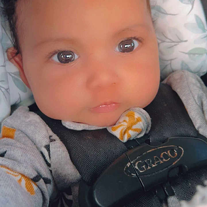 Bryant joined the competition — help win amazing prizes! baby, bodypart, bonnet, car, clothing, cushion, electronics, face, finger, hand, hat, head, homedecor, hood, newborn, person, photography, portrait, transportation, vehicle