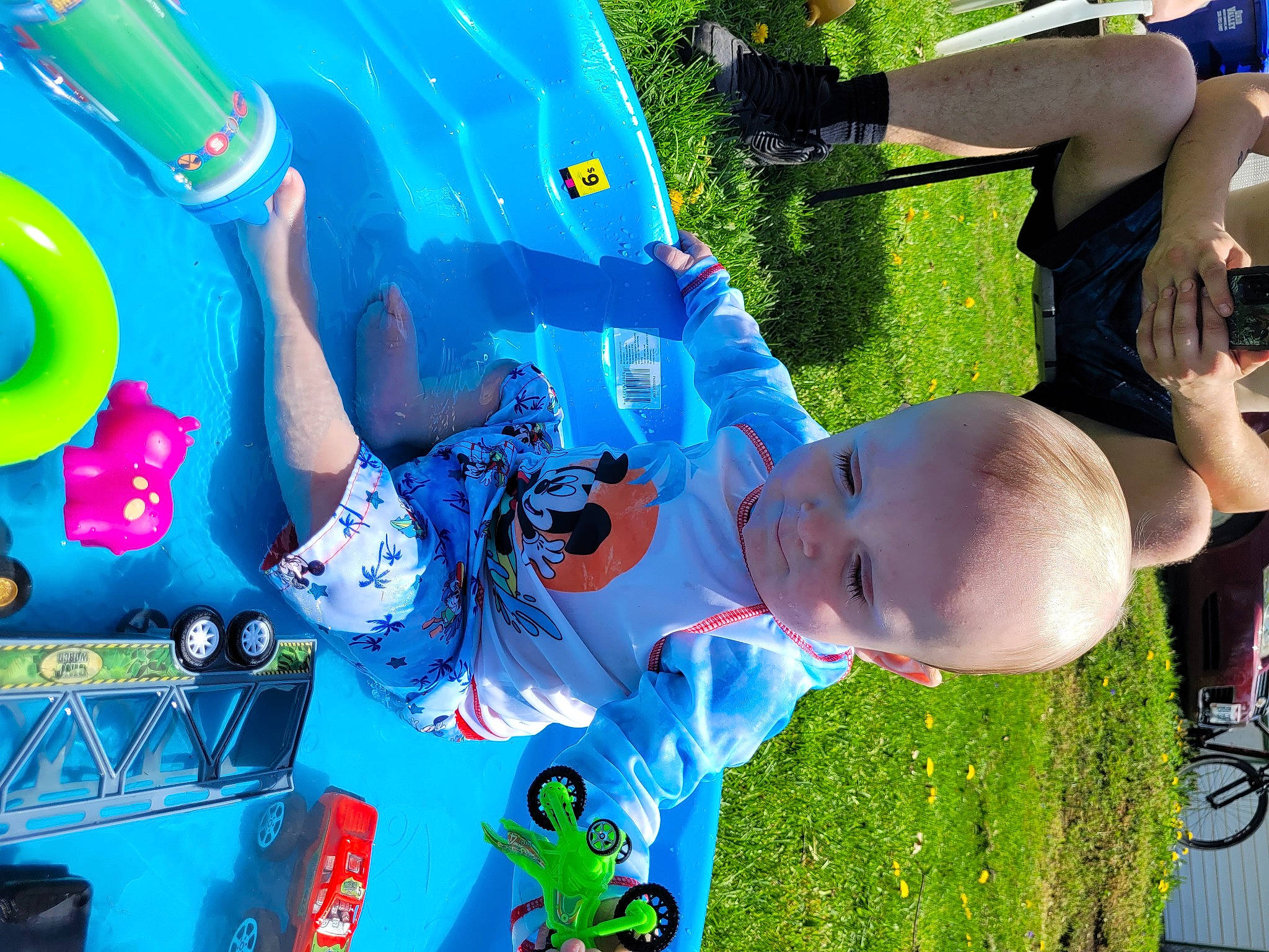 Cason is registered to the contest to win money with this photo: baby, blue, child, electric_blue, fun, games, grass, green, happy, hat, leisure, person, plant, play, product, recreation, snapshot, toddler, tree, water