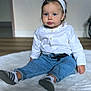 baby, blue_eyes, casual_clothing, child, cozy, cute, denim_jeans, floor, hands, headband, indoor, person, portrait, rug, sitting, sneakers, soft_lighting, toddler, white_shirt, young_child