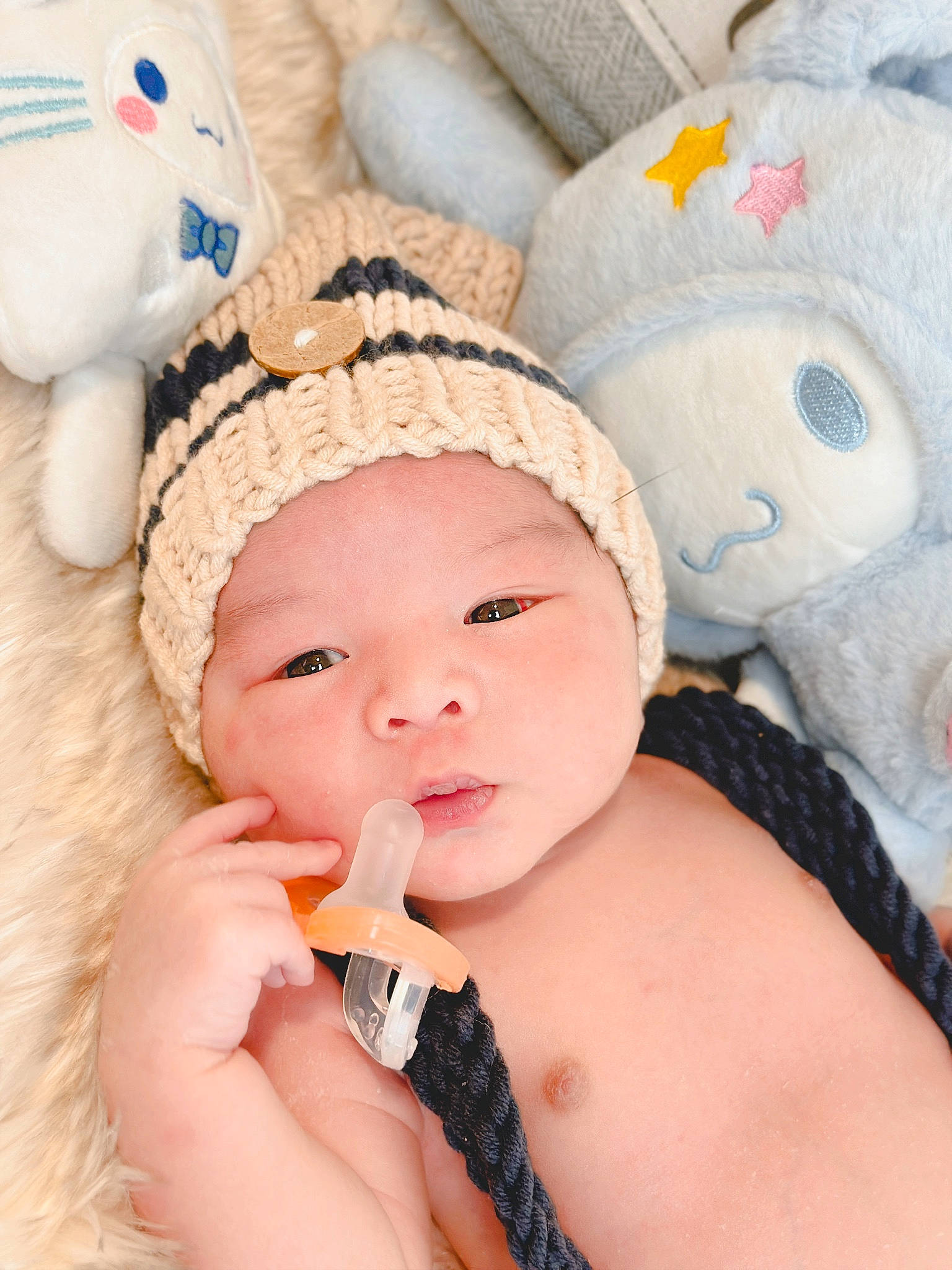 Aiden joined the competition — help win amazing prizes! baby, baby_products, baby_sleeping, baby_toddler_clothing, cap, cheek, child, comfort, eyelash, face, fashion_accessory, finger, happy, headgear, headwear, linens, nose, person, pink, skin