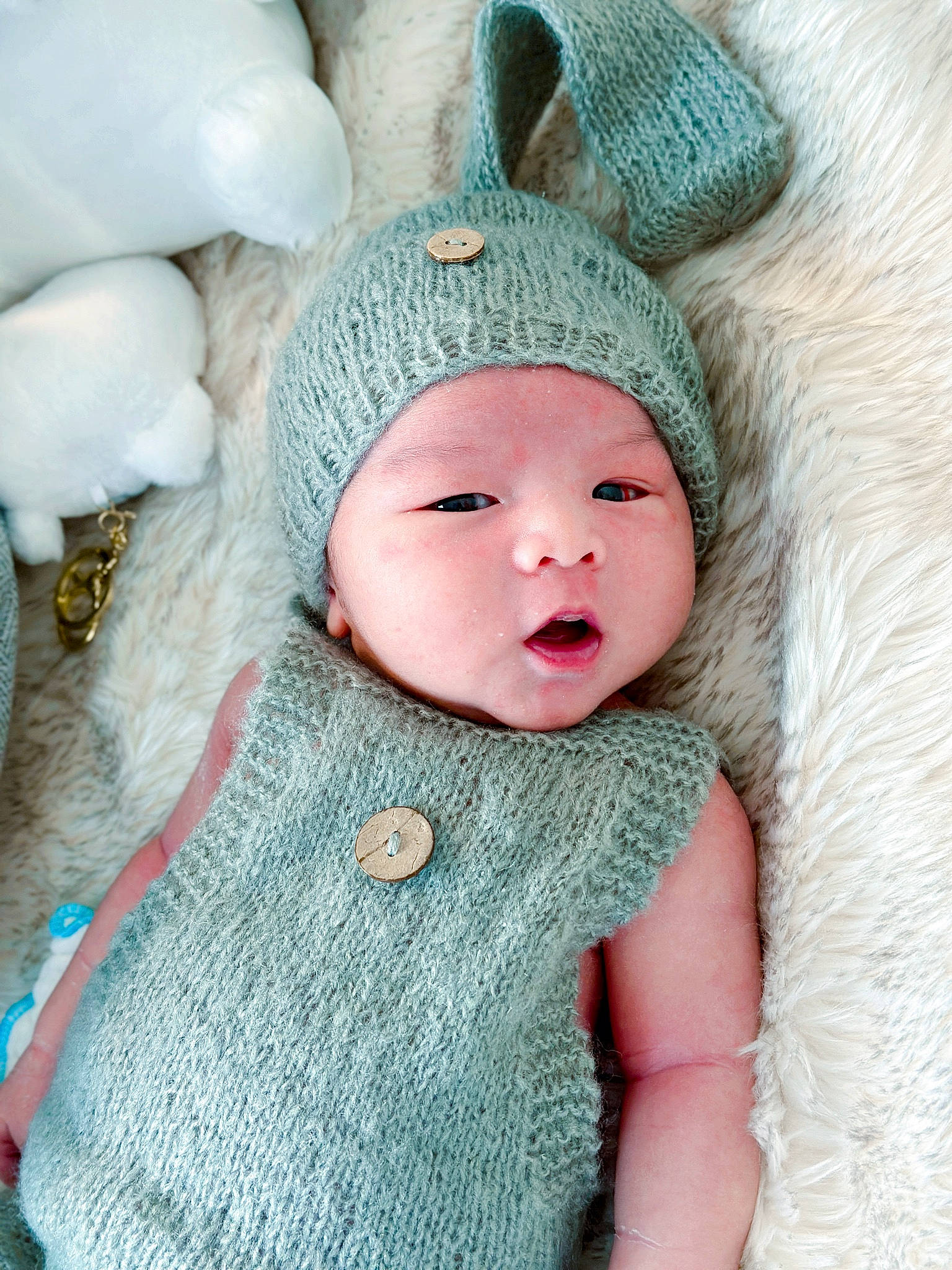 Aiden is registered to the contest to win money with this photo: baby, baby_toddler_clothing, beanie, cap, cheek, child, costume_hat, face, fashion_accessory, fur, headwear, human_body, knit_cap, outerwear, pattern, person, pink, sleeve, textile, toddler