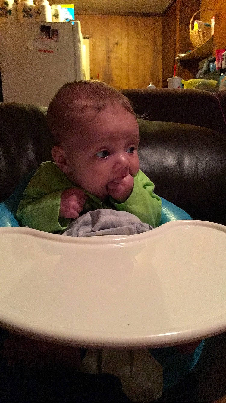 Axl joined the competition — help win amazing prizes! baby, chair, cheek, child, eating, face, head, person, sitting, skin, toddler