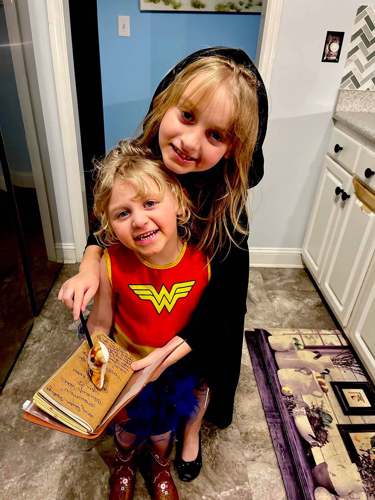 Taylor joined the competition — help win amazing prizes! baby_toddler_clothing, blond, cabinetry, chair, child, door, event, face, floor, flooring, fun, happy, hardwood, joy, mammal, people, person, picture_frame, sitting, smile