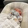 Lincoln is registered to the contest to win money with this photo: newborn, baby, sleeping, pajamas, mittens, blanket, baby_lounger, face, infant, cozy, indoor, soft_light, cushion, cute, peaceful, child, resting, dinosaur_print, fabric, home