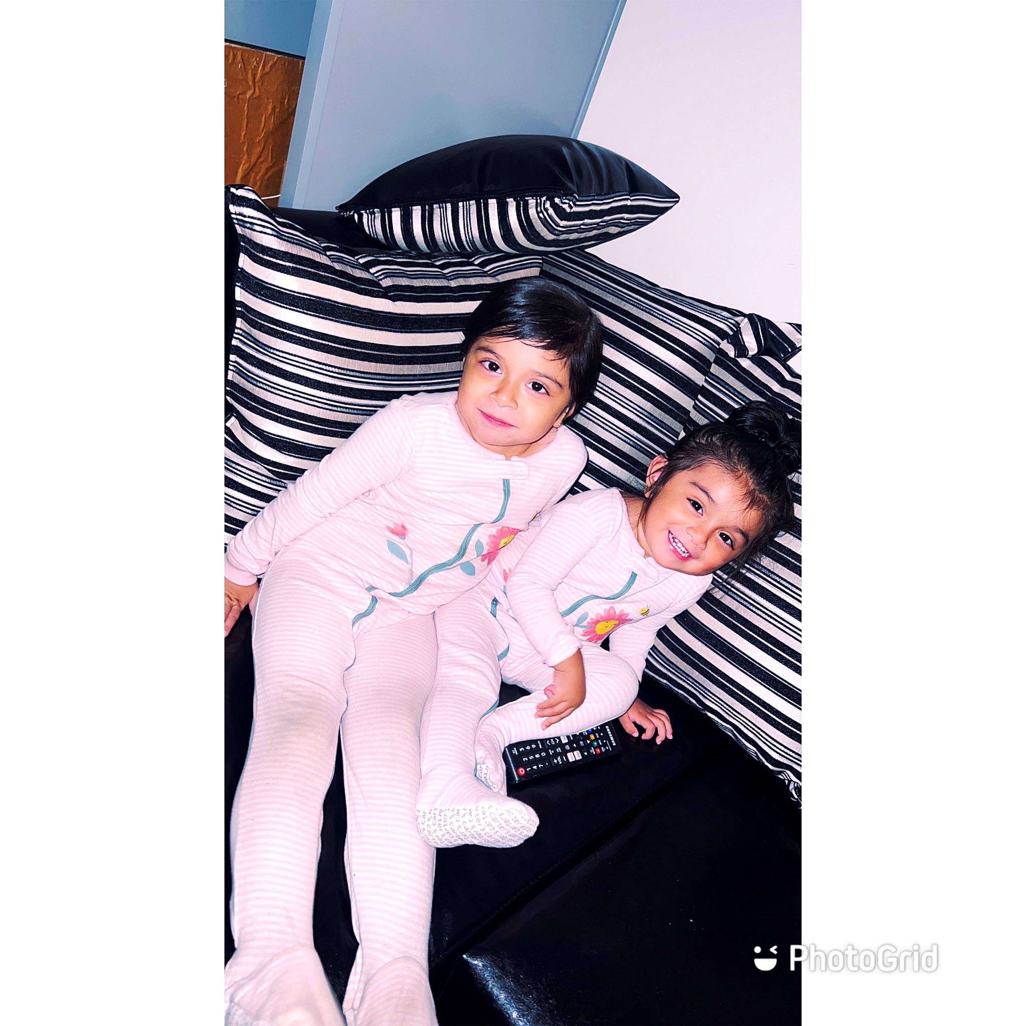 Alaia is registered to the contest to win money with this photo: advertising, baby, child, comfort, fashion_accessory, flash_photography, font, formal_wear, gesture, happy, joy, linens, magenta, pattern, person, sitting, sleeve, sportswear, suit, t_shirt