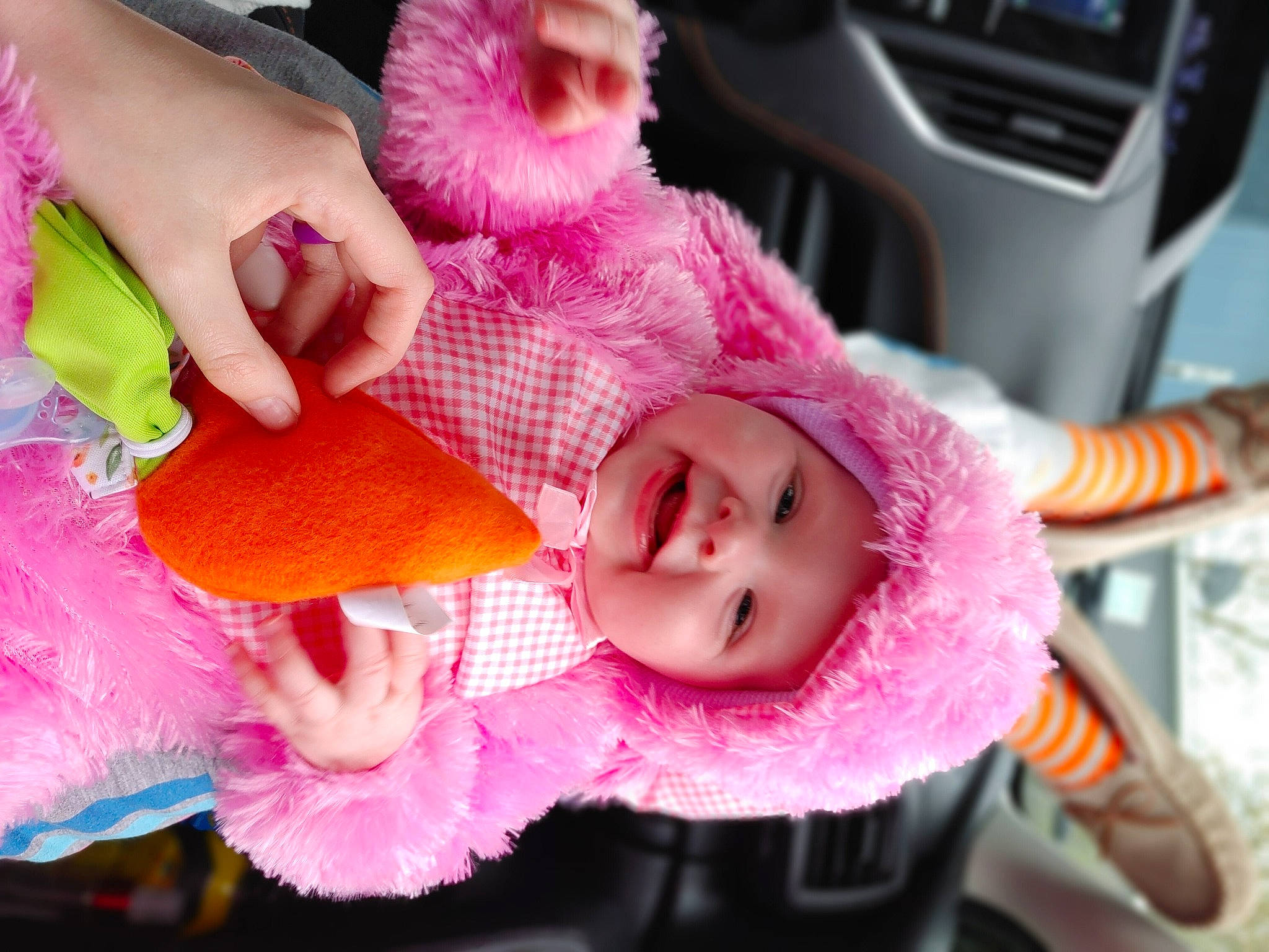 Oakley is registered to the contest to win money with this photo: baby, baby_products, child, eyelash, fashion_accessory, fun, hand, happy, headwear, human_body, magenta, person, pink, product, purple, skin, smile, stuffed_toy, sunglasses, toddler
