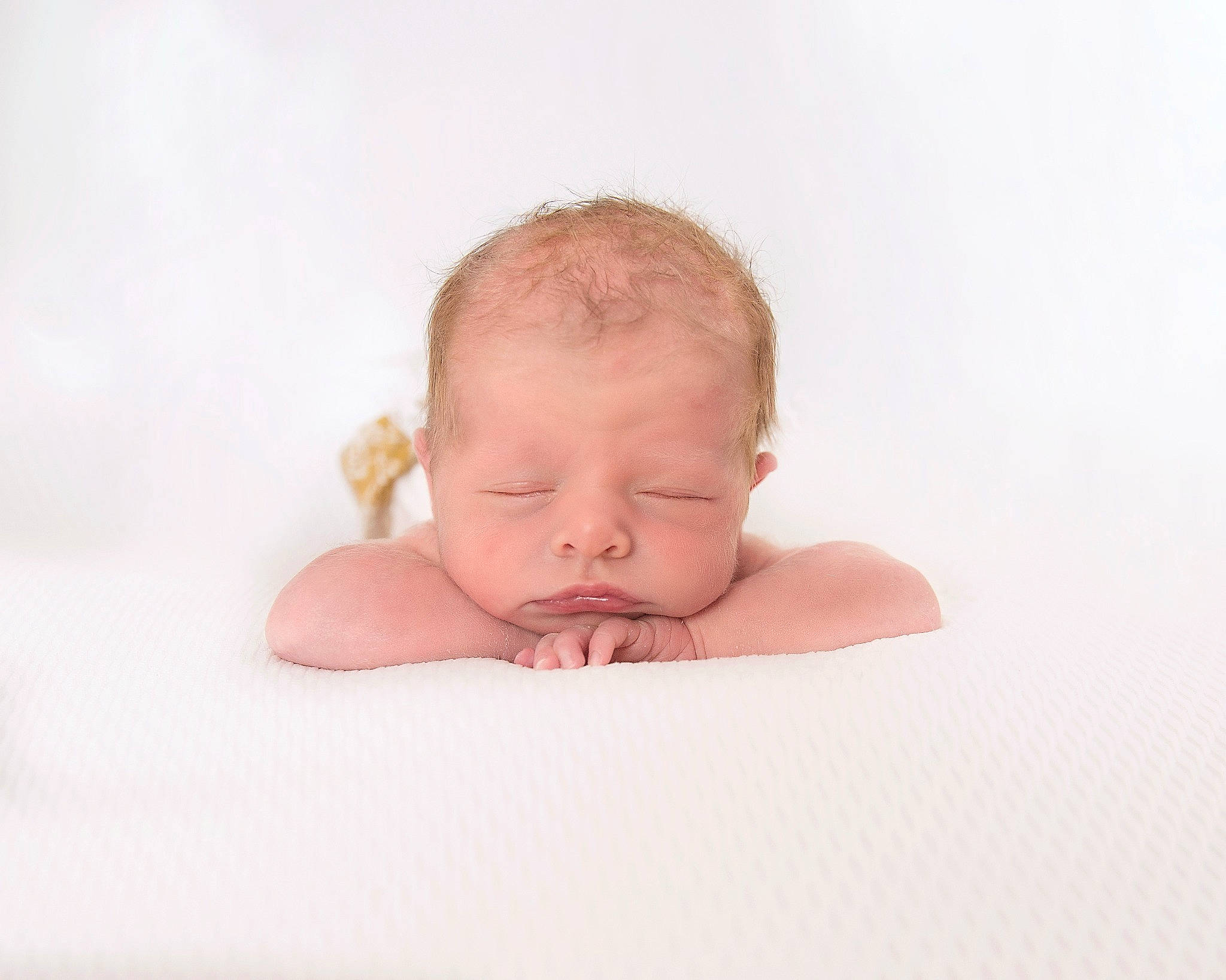Oakley is registered to the contest to win money with this photo: arm, baby, baby_sleeping, baby_toddler_clothing, cheek, comfort, eye, flash_photography, flesh, foot, fun, happy, headgear, linens, person, portrait_photography, sitting, stomach, toddler, towel
