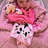 Bella joined the competition — help win amazing prizes! baby, blanket, child, clothing, comfort, cow_pattern, cute, expression, face, indoors, infant, newborn, person, pink, plush_toy, portrait, resting, soft_texture, toddler, wrapped
