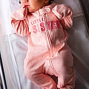 Bella joined the competition — help win amazing prizes! baby, baby_clothes, blanket, child, crib, cute, headband, indoors, infant, newborn, peaceful, person, pink_onesie, portrait, rest, sleep, sleeping, small_person, soft_lighting, striped_headband