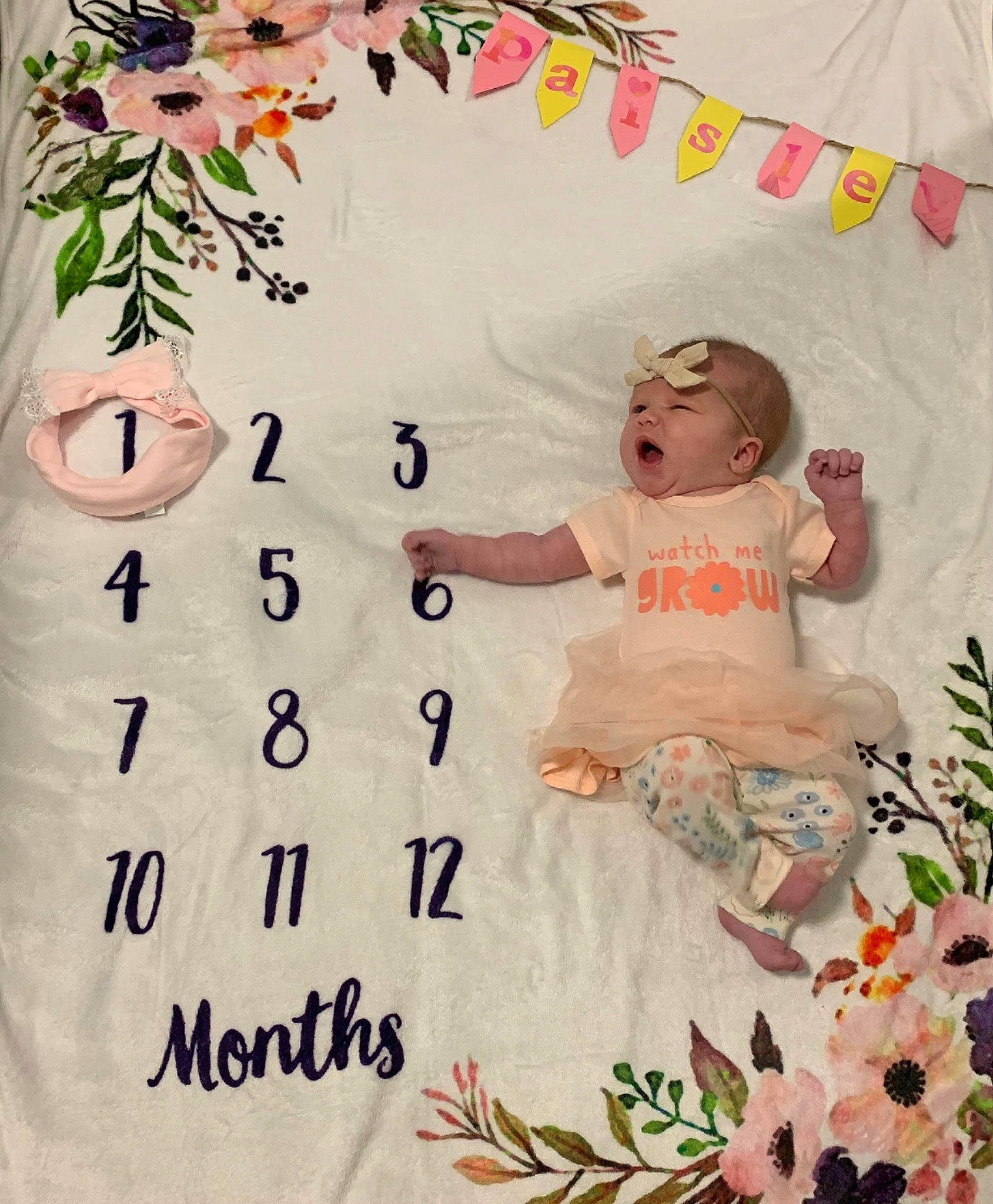 Paisley Mae joined the competition — help win amazing prizes! baby, baby_toddler_clothing, beauty, child, design, font, happy, headwear, illustration, leaf, linens, pattern, peach, people_in_nature, person, pink, plant, product, textile, toddler