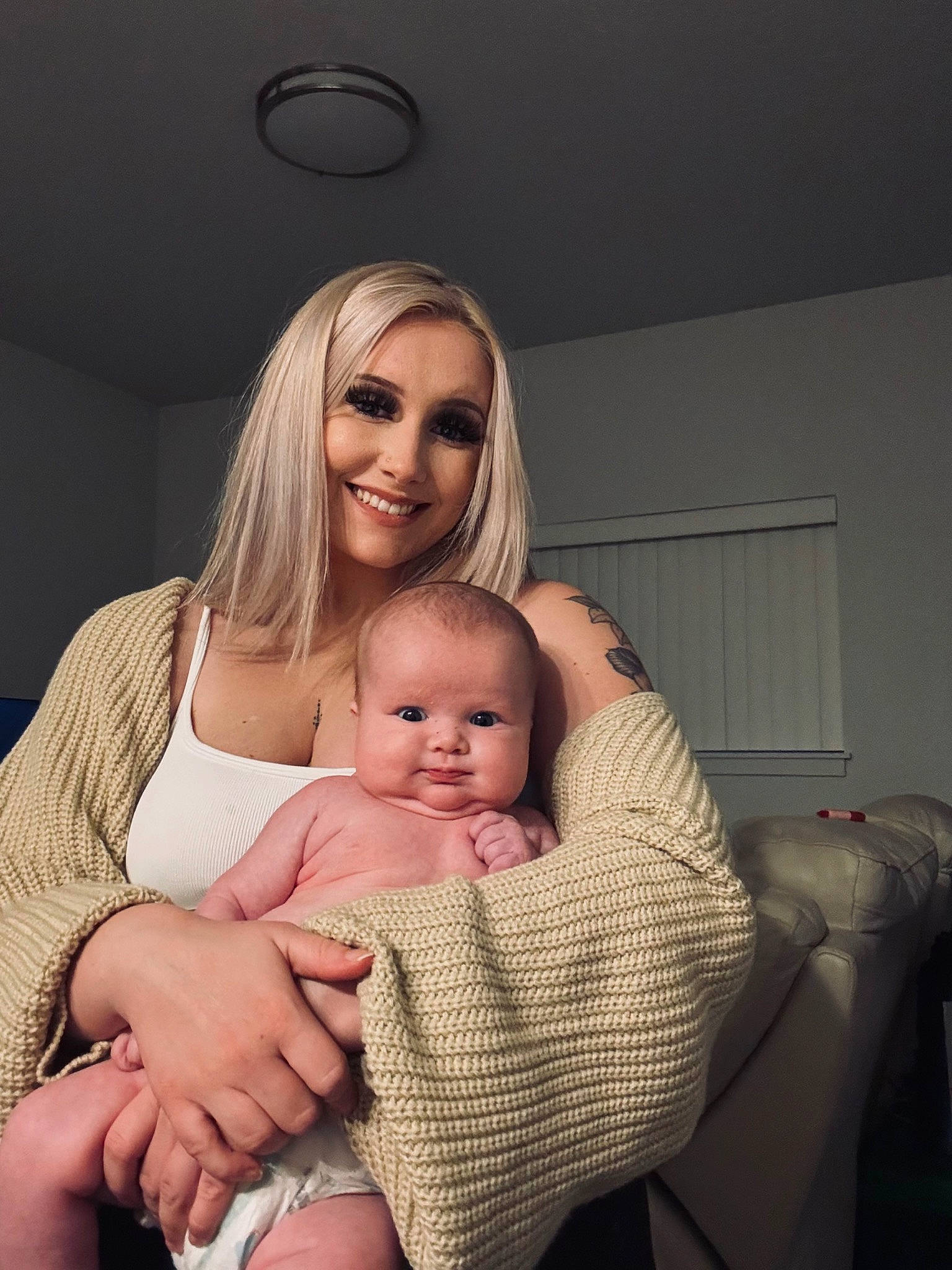 Paisley Mae is registered to the contest to win money with this photo: abdomen, baby, child, comfort, elbow, event, finger, flash_photography, gesture, happy, human_leg, interaction, joy, person, shoulder, sitting, skin, smile, stomach, thigh