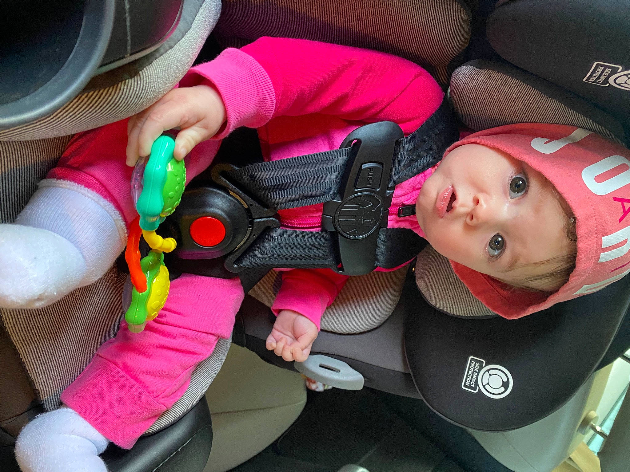 Rubie is registered to the contest to win money with this photo: auto_part, automotive_design, baby_carriage, baby_products, car_seat, car_seat_cover, carmine, child, cool, fashion_accessory, fedora, fun, hat, headwear, magenta, motor_vehicle, nail, person, pink, red