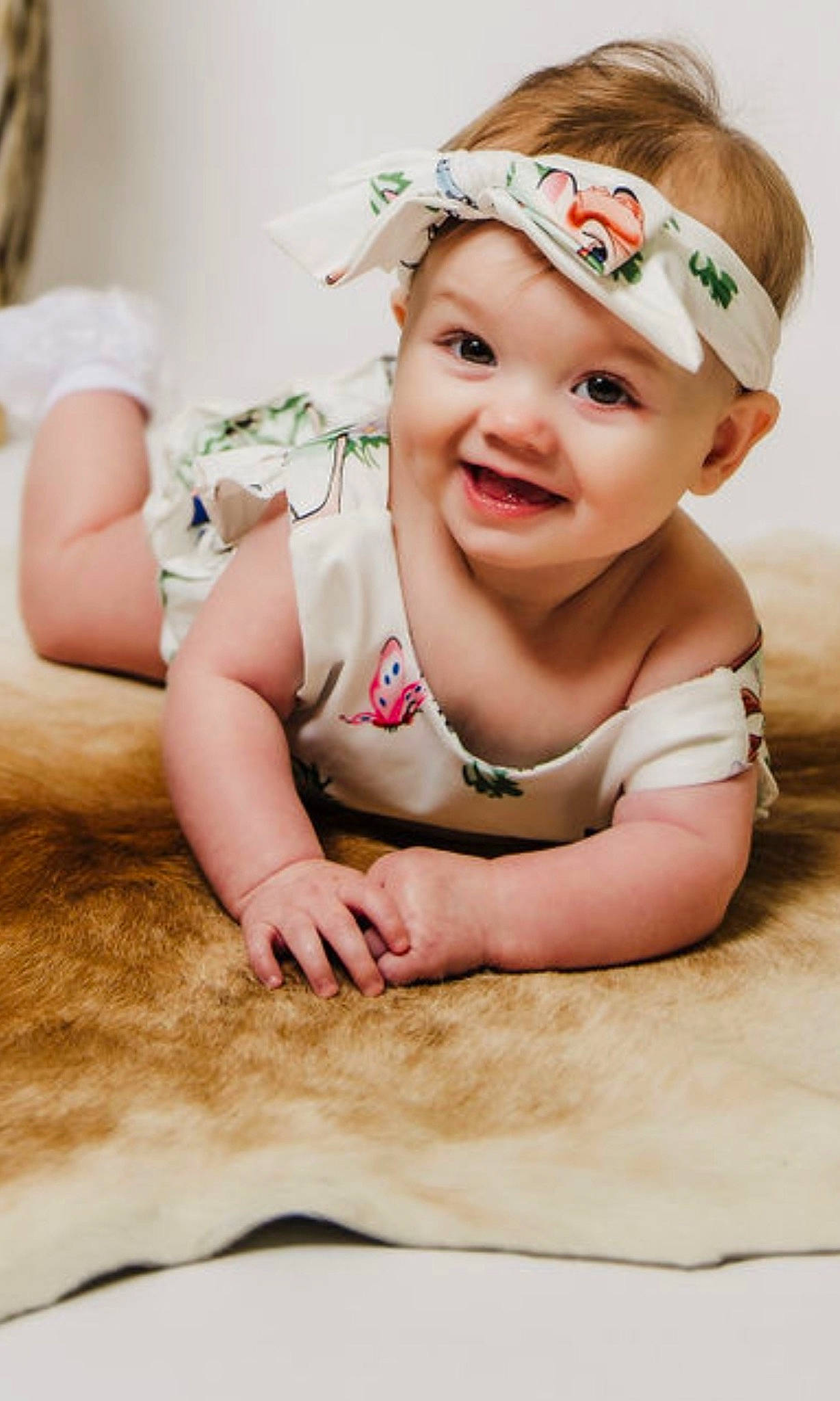 Rubie joined the competition — help win amazing prizes! baby, cap, cheek, child, clothing, eyebrow, finger, flash_photography, flooring, gesture, happy, head, headband, headgear, headpiece, human_leg, joy, lip, person, skin