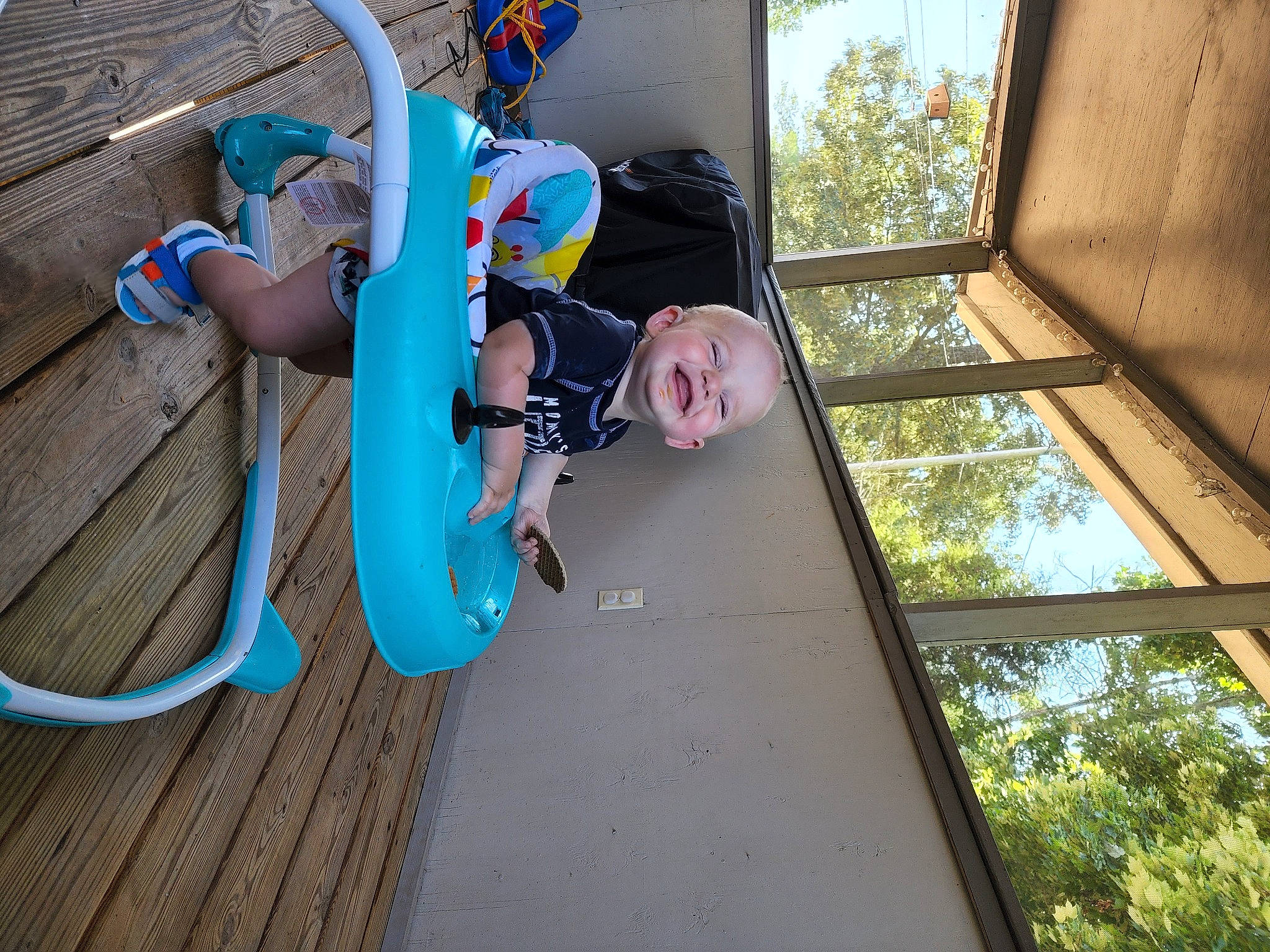 Holden is registered to the contest to win money with this photo: adventure, blue, child, city, electric_blue, fun, hardwood, hat, joy, leisure, outdoor_play_equipment, person, play, recreation, rope, shorts, smile, toddler, tree, wire