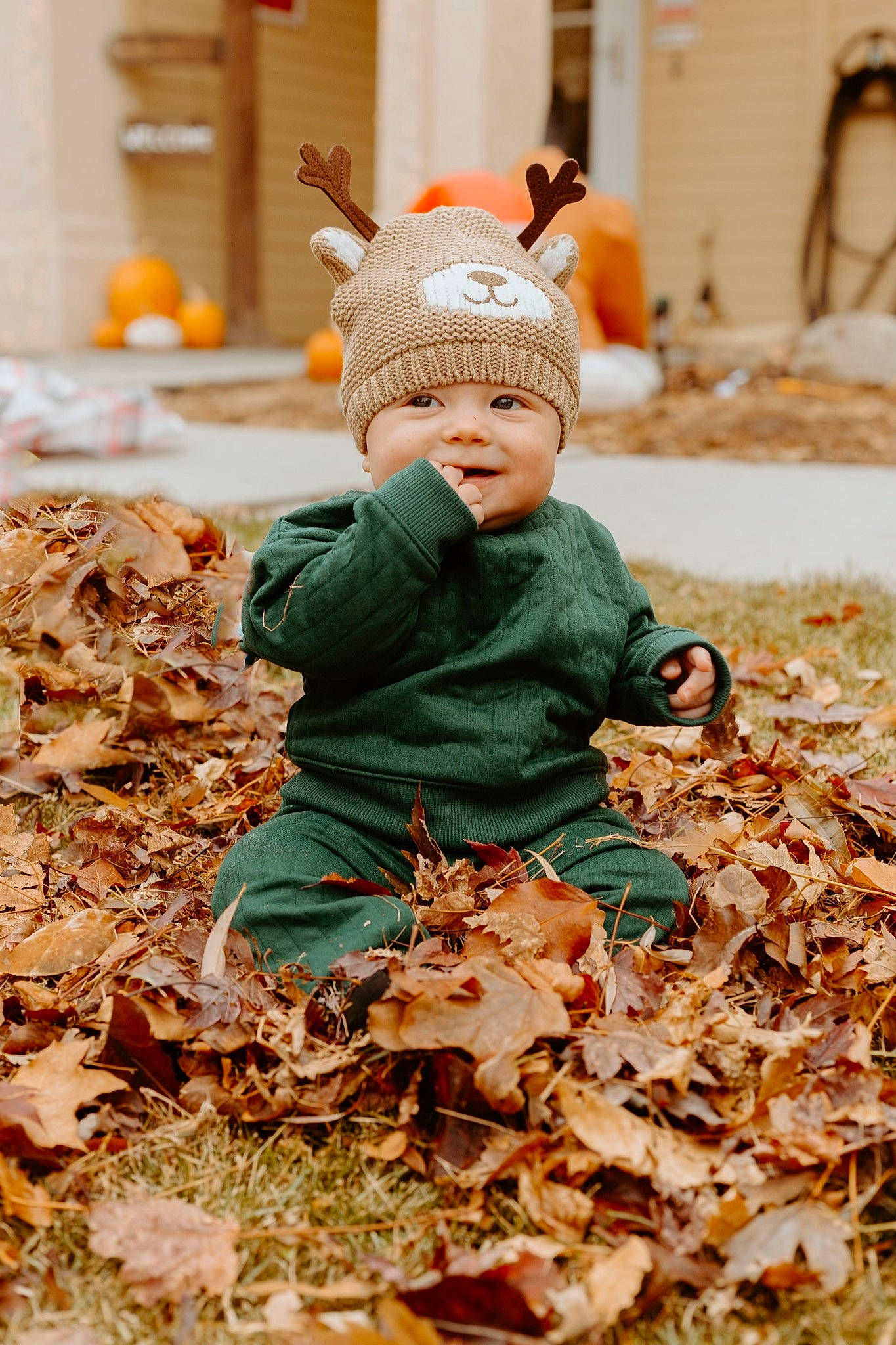 Kaiyzen is registered to the contest to win money with this photo: autumn, baby, baby_toddler_clothing, beanie, child, deciduous, grass, happy, headwear, people, people_in_nature, person, plant, portrait_photography, sitting, toddler, tree, winter, wood