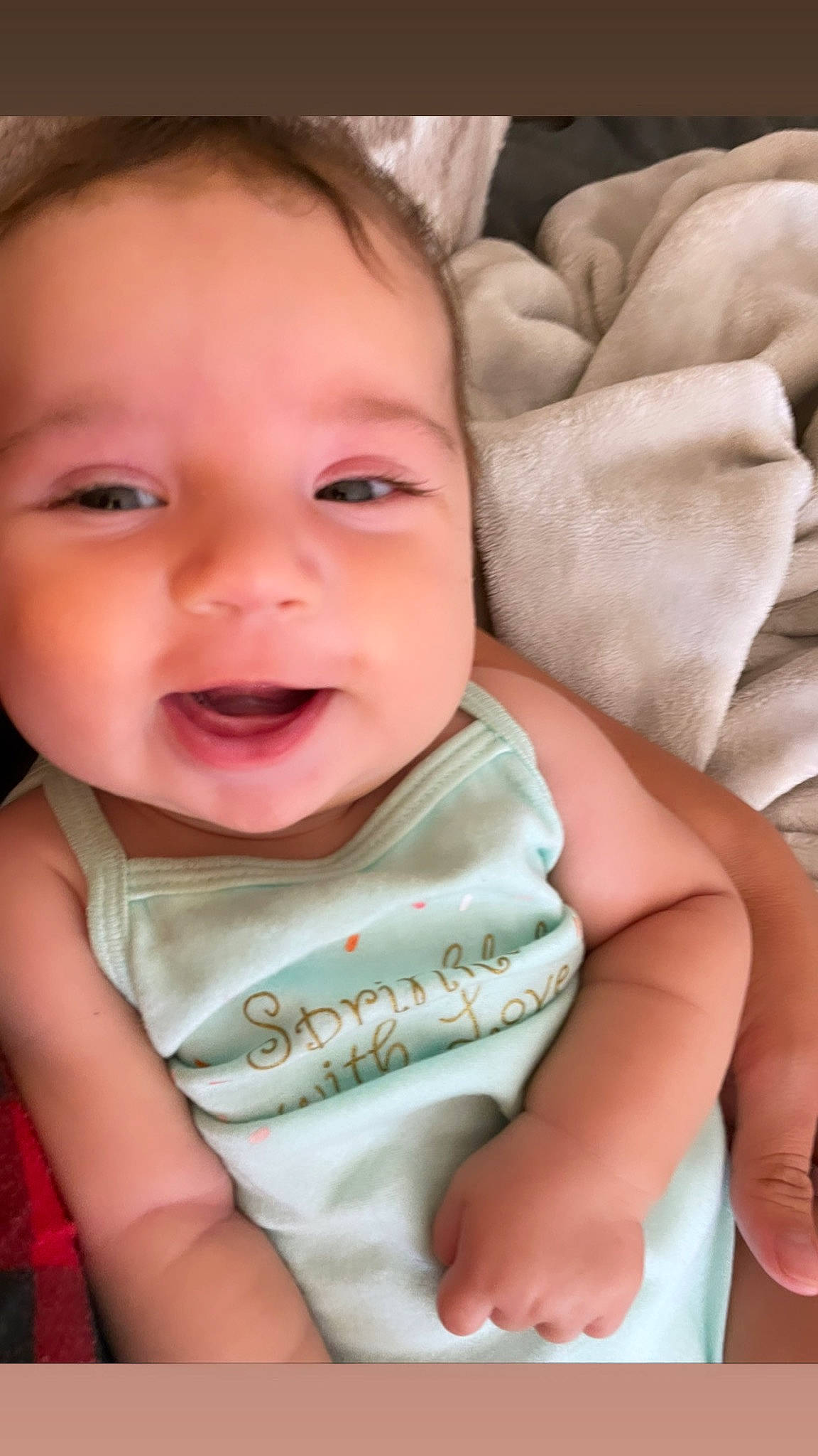 Lola is registered to the contest to win money with this photo: baby, baby_toddler_clothing, cheek, chin, comfort, eyebrow, eyelash, finger, happy, iris, linens, lip, mouth, nose, person, pink, skin, sleeve, smile, textile