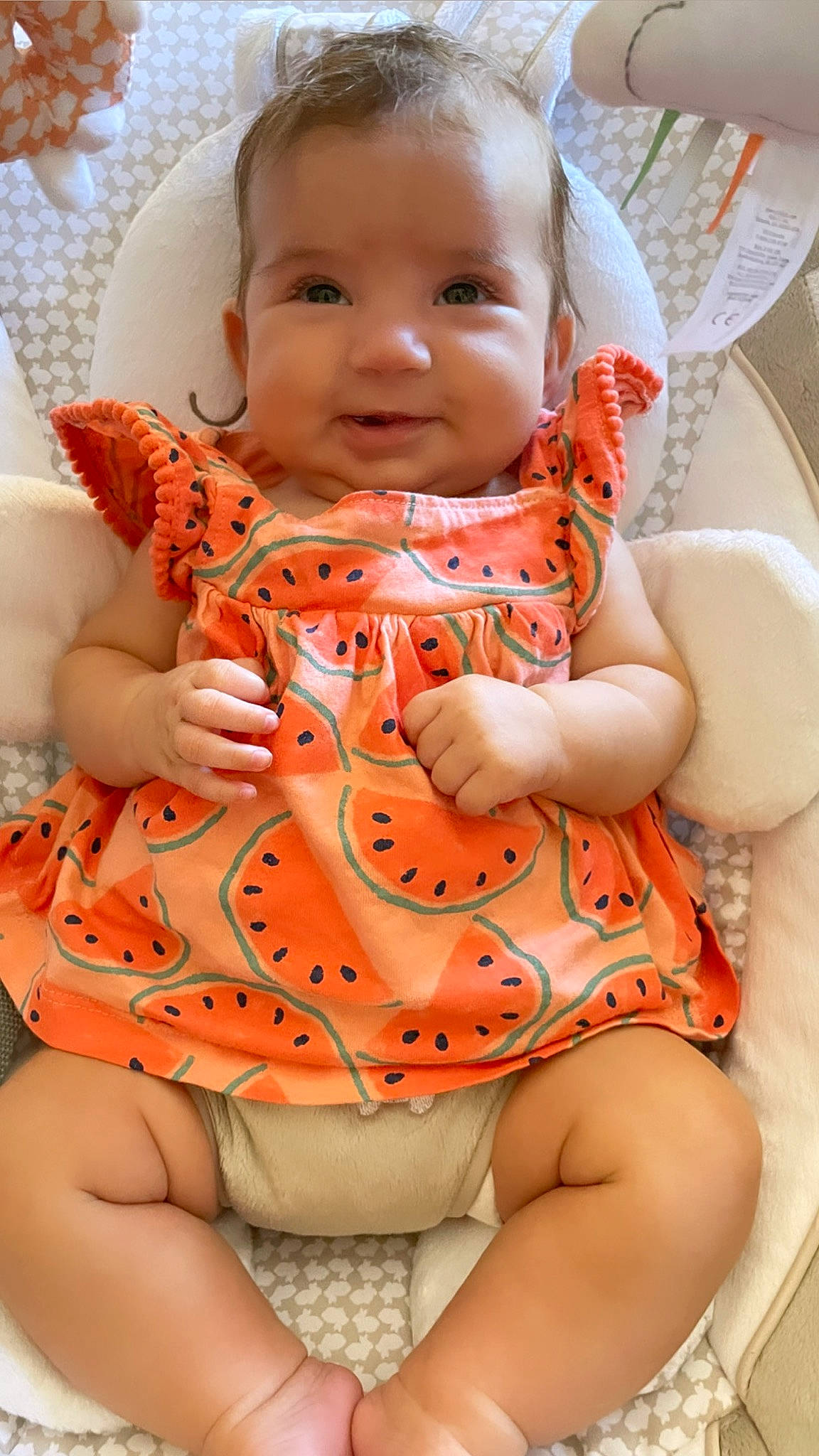 Lola joined the competition — help win amazing prizes! baby, baby_toddler_clothing, chair, cheek, comfort, dress, eye, face, finger, hand, head, human_body, joy, mouth, neck, orange, person, pink, skin, sleeve