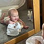 baby, infant, mirror, reflection, carpet, smiling, clothing, bedroom, wooden_furniture, bottle, lotion, diaper, floor, crawling, happy, indoor, child, person, baby_care, mirror_reflection