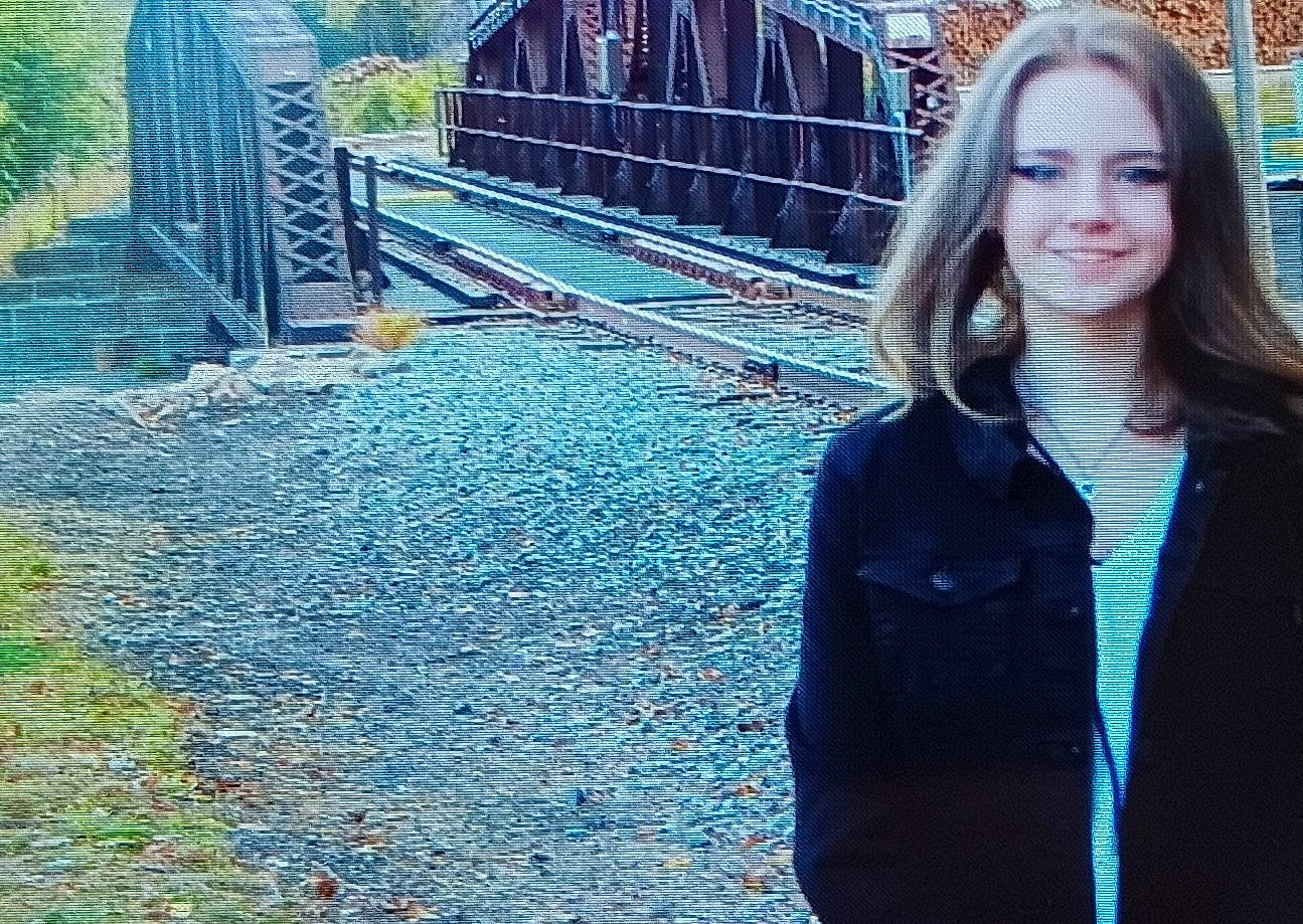 Faith is registered to the contest to win money with this photo: beauty, bridge, city, denim, electric_blue, fun, grass, happy, joy, leisure, metal, pedestrian, person, plant, recreation, smile, street, tints_and_shades, track, travel