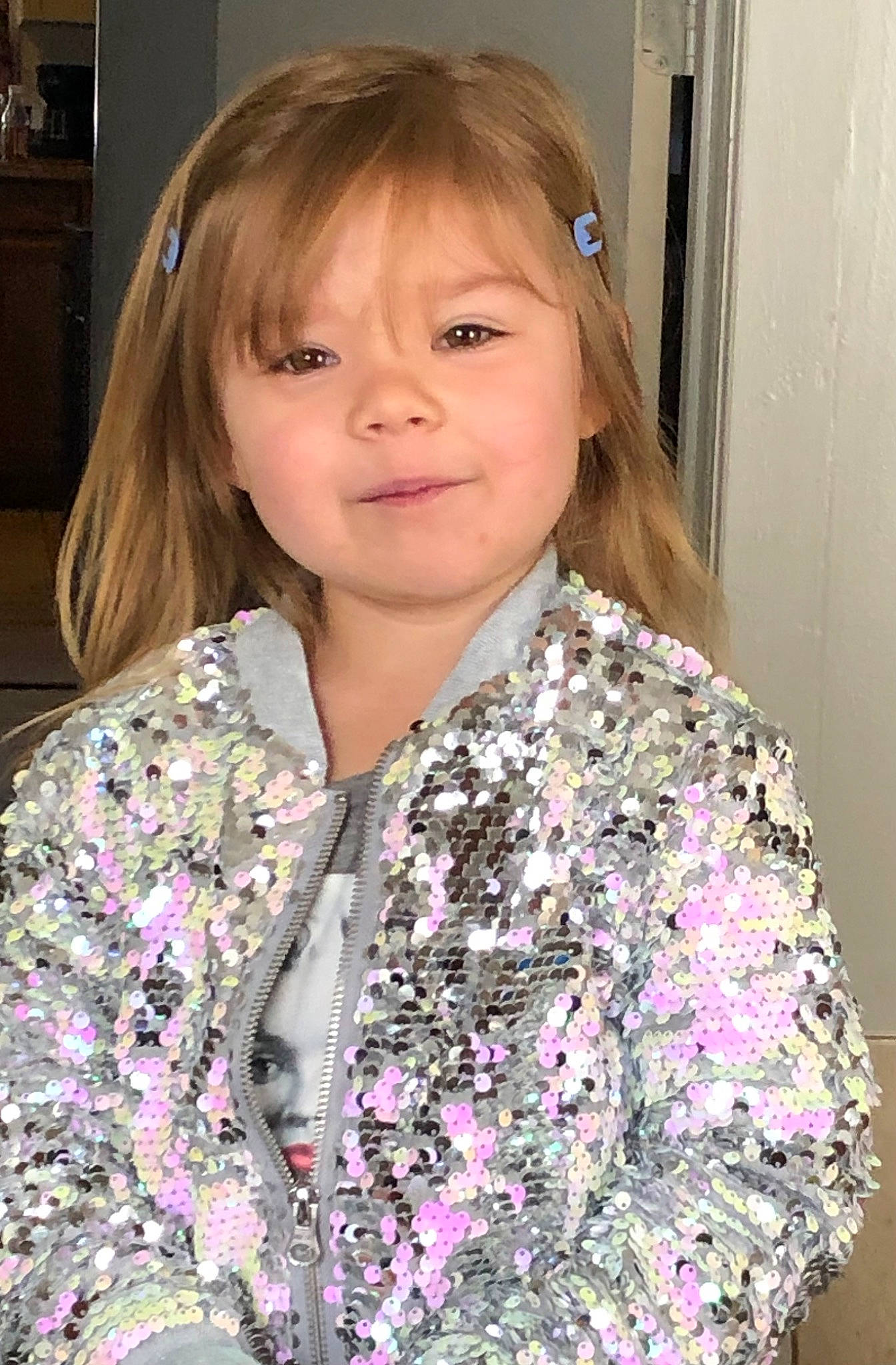 Braylyn is registered to the contest to win money with this photo: bangs, cheek, chin, dress_shirt, eye, eyelash, face, hair, head, iris, joy, lip, long_hair, nose, outerwear, person, plant, shirt, skin, sleeve