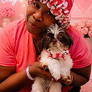 Mister joined the competition — help win amazing prizes! woman, dog, puppy, knitted_hat, pink_shirt, bow_tie, flowers, indoor, portrait, smiling, happy, pet, cute, cozy, home, decor, pink_theme, text_overlay, lighting, holding