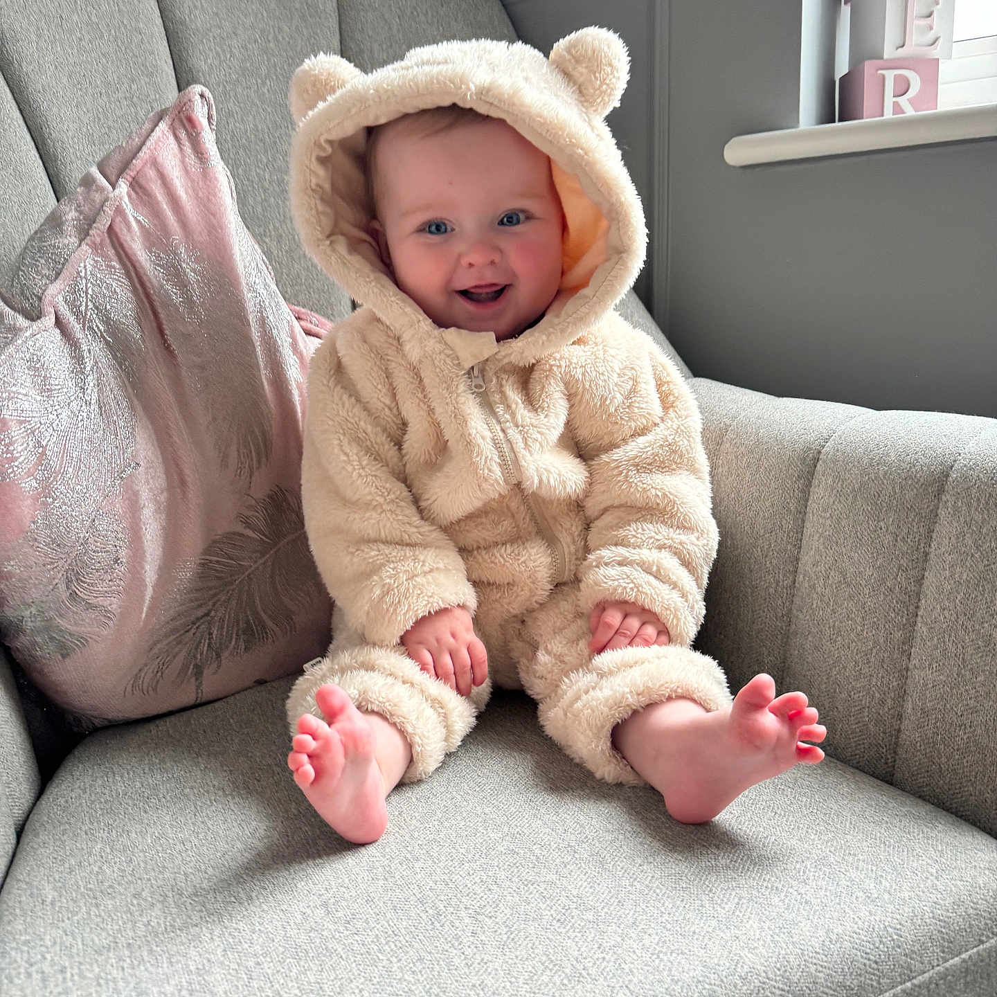 Harper joined the competition — help win amazing prizes! baby, bodypart, bonnet, chair, clothing, couch, face, finger, furniture, hand, happy, hat, head, knitwear, person, photography, portrait, sitting, smile, sweater