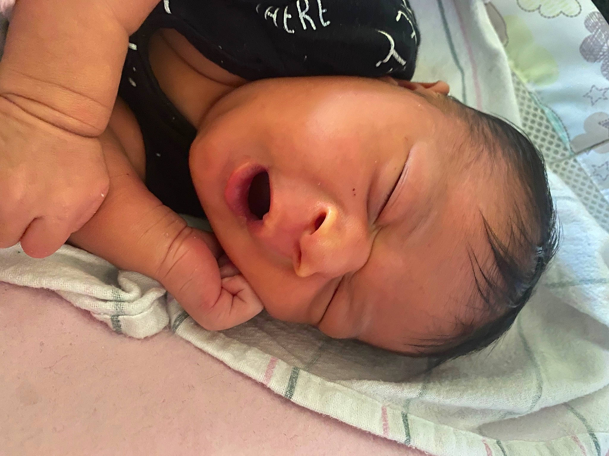 Haylo is registered to the contest to win money with this photo: baby, baby_toddler_clothing, bedtime, cheek, child, comfort, finger, flesh, gesture, happy, linens, mouth, nail, nap, nose, pattern, person, skin, sleep, thumb