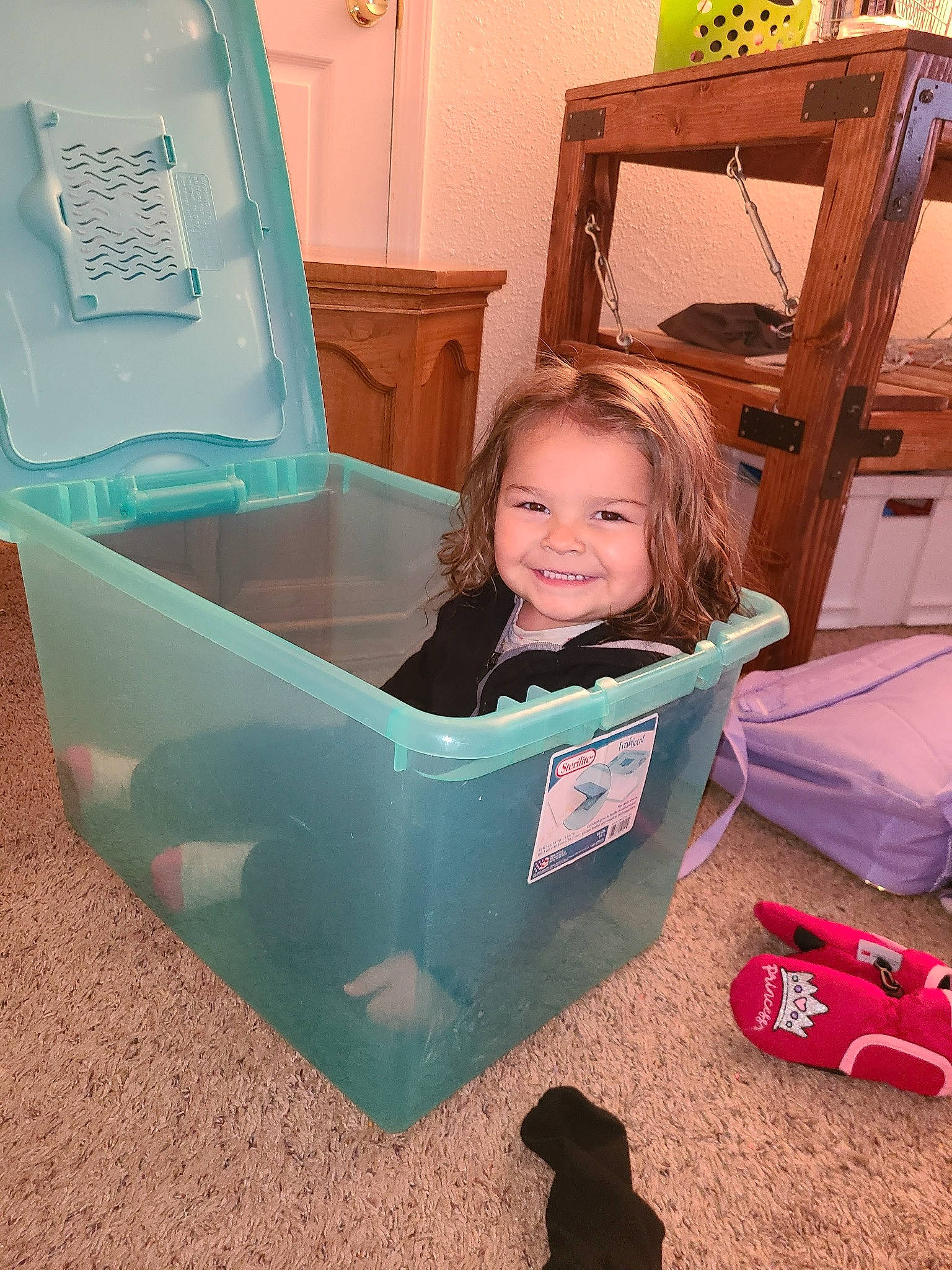 Tynnessee joined the competition — help win amazing prizes! automotive_exterior, baby, baby_toddler_clothing, box, chair, child, drawer, flooring, fun, happy, hardwood, joy, leisure, person, plastic, play, room, sitting, smile, toddler