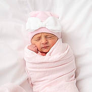 Addison Rhea Grace is registered to the contest to win money with this photo: baby, bed, blanket, bonnet, clothing, face, furniture, happy, hat, head, newborn, people, person, photography, portrait, sleeping, smile