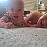 Nyla is registered to the contest to win money with this photo: baby, child, siblings, toddler, infant, portrait, lying_down, carpet, living_room, indoors, face, eyes, smile, curious, family, playful, clothing, bookshelf, couch, home