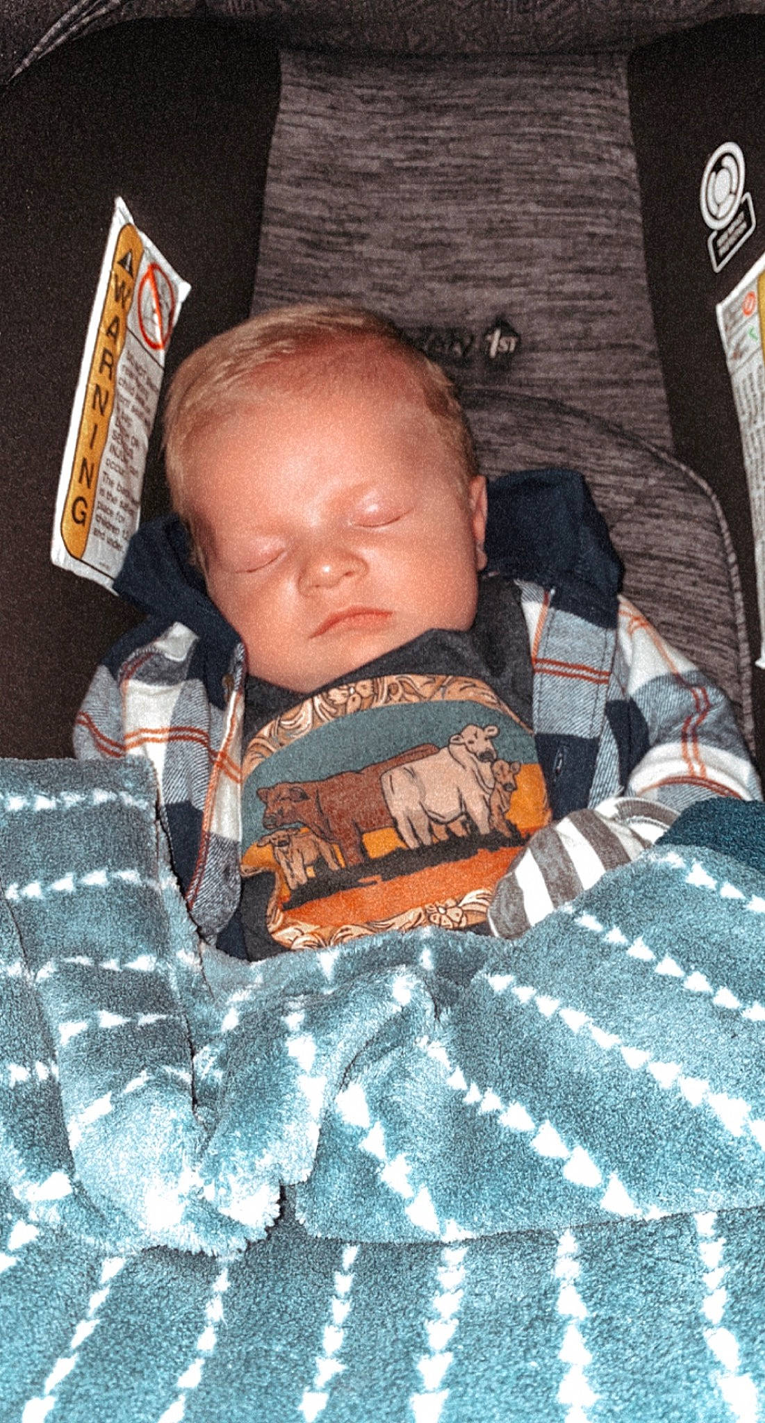 Kayden is registered to the contest to win money with this photo: baby, baby_products, baby_toddler_clothing, bedtime, camouflage, cheek, child, comfort, cool, fun, linens, mammal, military_camouflage, orange, pattern, person, plaid, room, sitting, sleeve