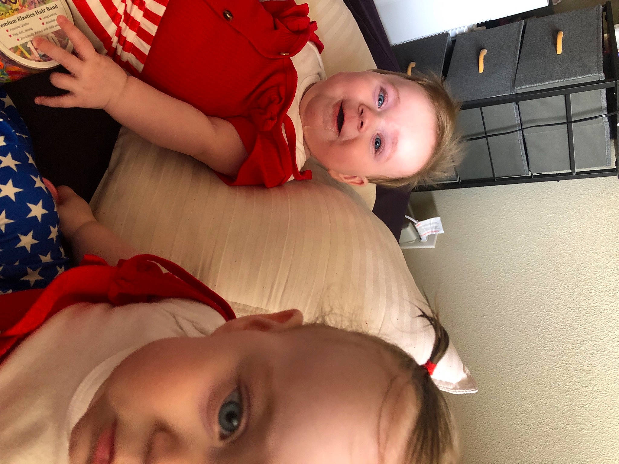 Lilly is registered to the contest to win money with this photo: arm, baby, baby_toddler_clothing, beauty, child, comfort, couch, event, eye, eyelash, finger, fun, happy, mouth, muscle, organ, person, red, skin, thigh