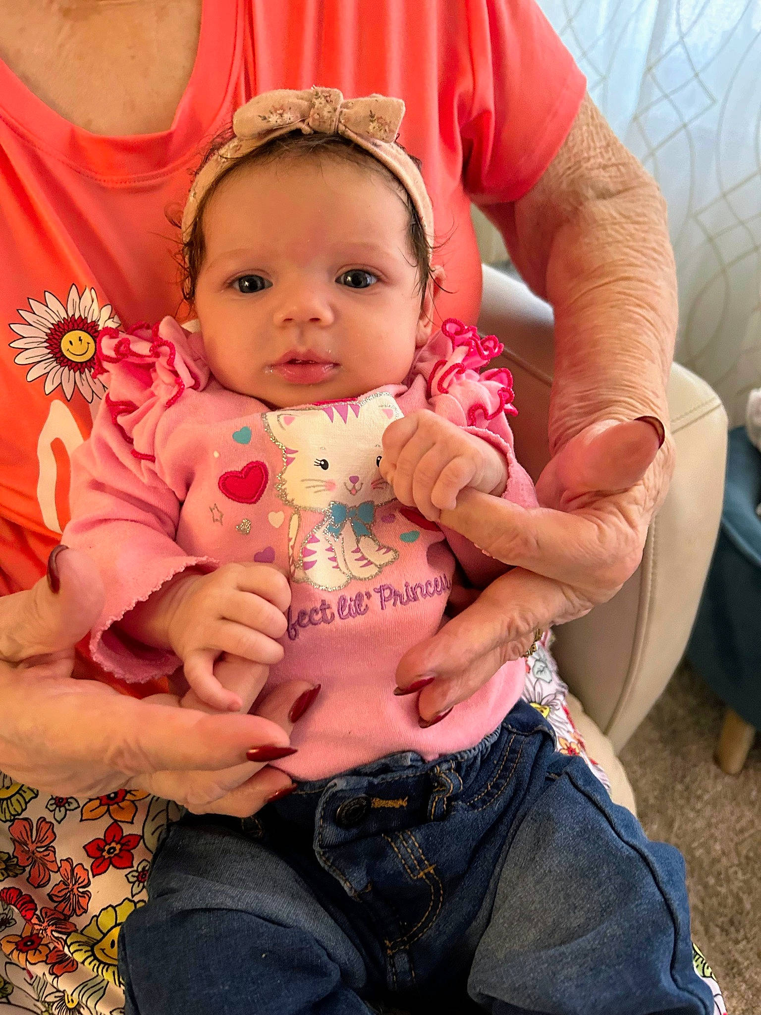 Makenna is registered to the contest to win money with this photo: abdomen, baby_toddler_clothing, cheek, eye, finger, hand, happy, head, human_body, jeans, joint, lap, mouth, person, pink, shoulder, skin, stomach, thigh, toddler