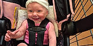 Annie joined the competition — help win amazing prizes! baby, infant, smiling, headband, car_seat, shopping_cart, straps, pink_clothing, happy, child, indoor, retail, store_floor, seatbelt, cute, small_hands, legs, padded_seat, person, toddler