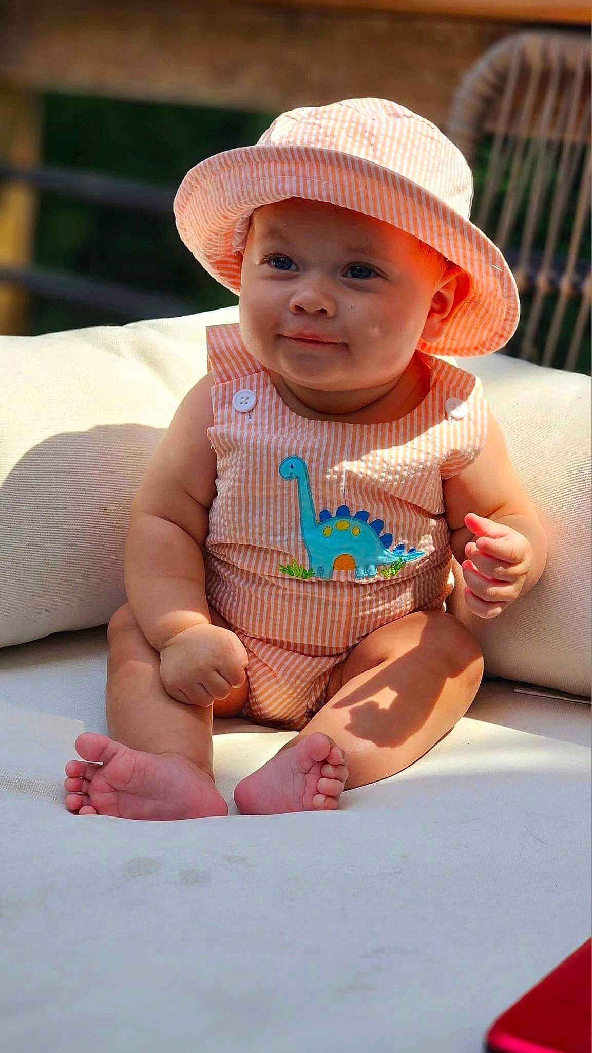 Syair is registered to the contest to win money with this photo: arm, baby, baby_toddler_clothing, cap, cheek, child, chin, finger, foot, fun, happy, headwear, lip, person, photograph, skin, sleeve, smile, stomach, sun_hat