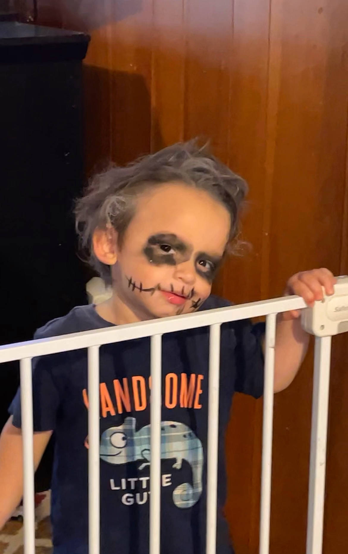 Mateo is registered to the contest to win money with this photo: beard, child, eyewear, facial_hair, fun, handrail, moustache, person, publication, room, sleeve, smile, sunglasses, t_shirt, toddler, wood