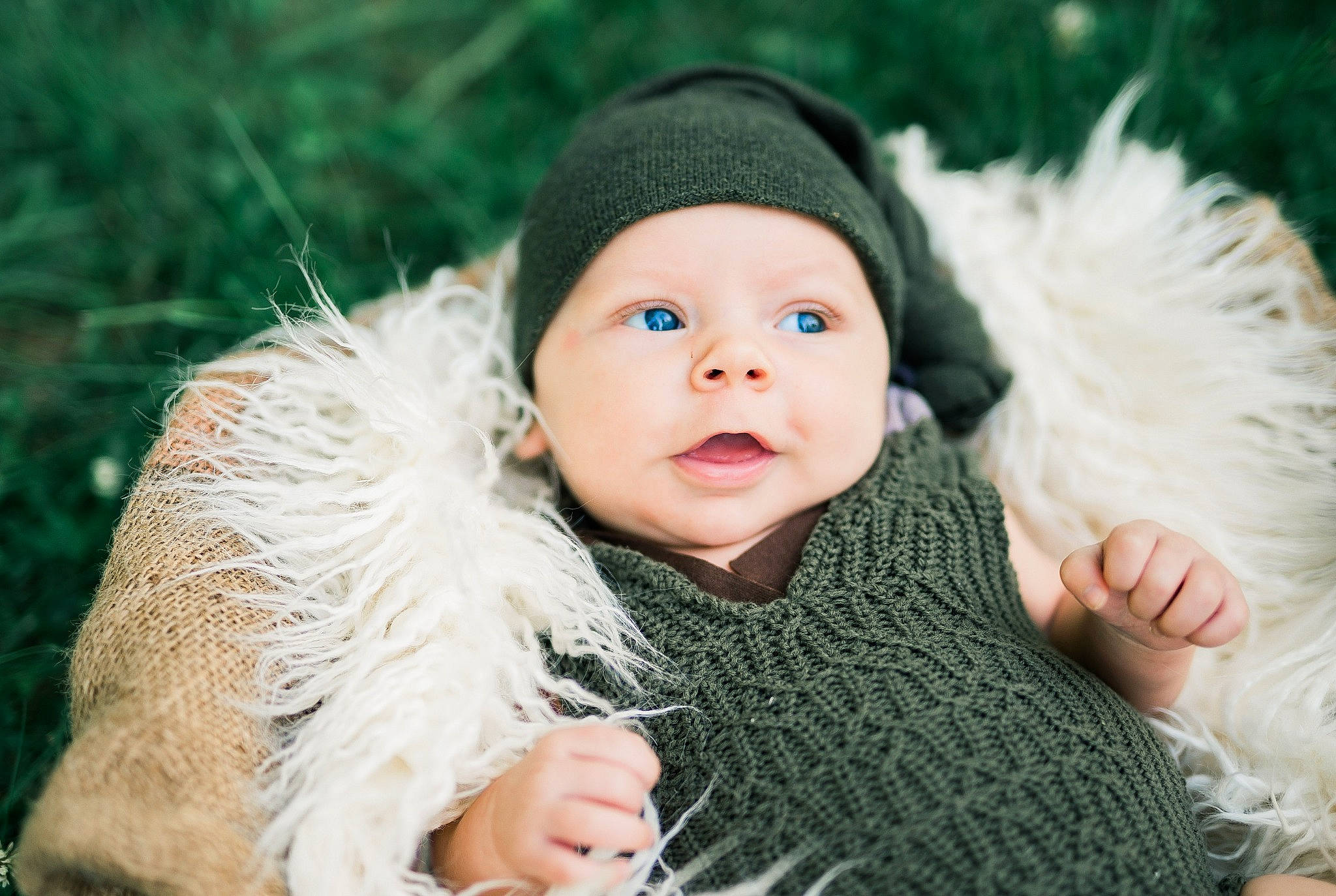 Giovanni is registered to the contest to win money with this photo: baby, cap, child, child_model, fur, fur_clothing, grass, hat, head, headgear, headwear, knit_cap, person, photograph, photography, portrait, portrait_photography, skin, toddler